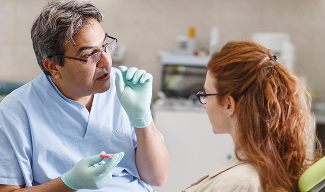 Woman talks to a dental expert